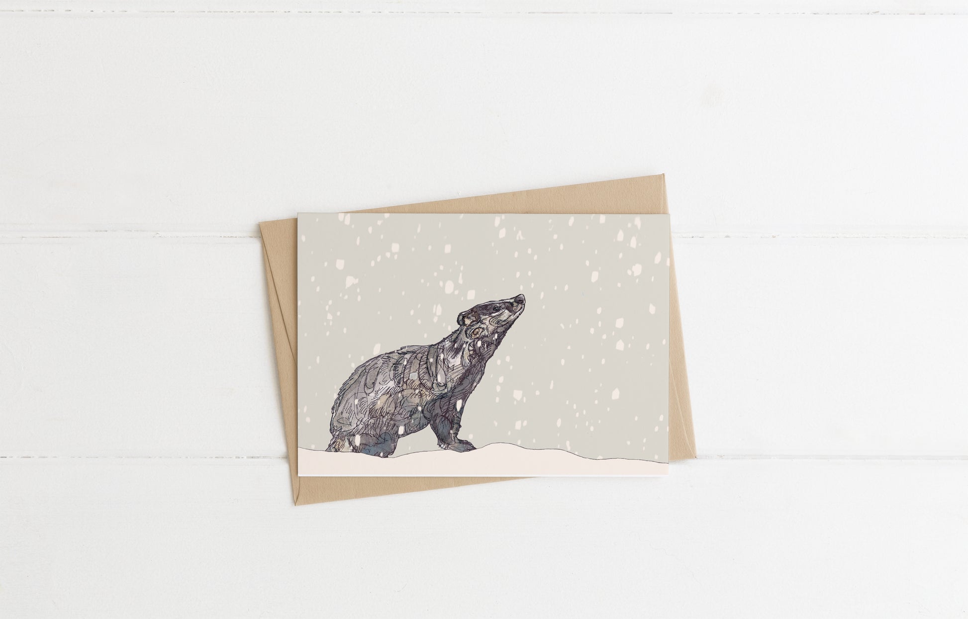 Blank greeting card and envelope wildlife art badger in snow wildlife illustration animal artist ann pease 